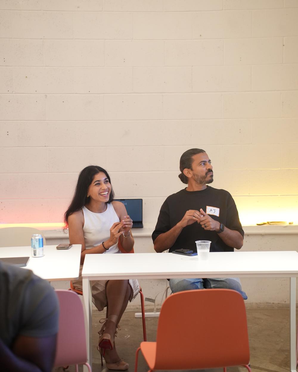 Sharon and AJ judging the pitch competition